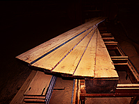 Milling vintage beams into Reclaimed Antique Heart Pine flooring - Southern Wood Floors